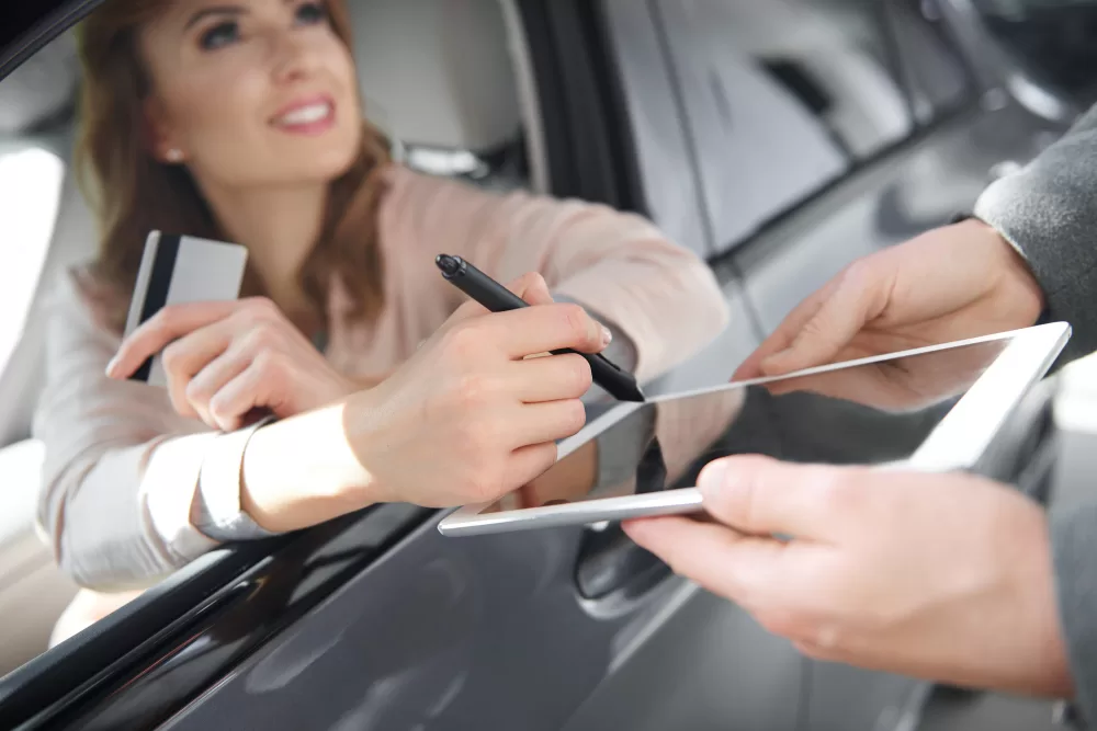 Digital marketing team analyzing luxury auto finance campaign performance across premium channels