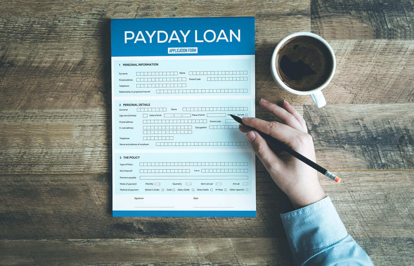 Loan officer reviewing payday loan application data on computer screen