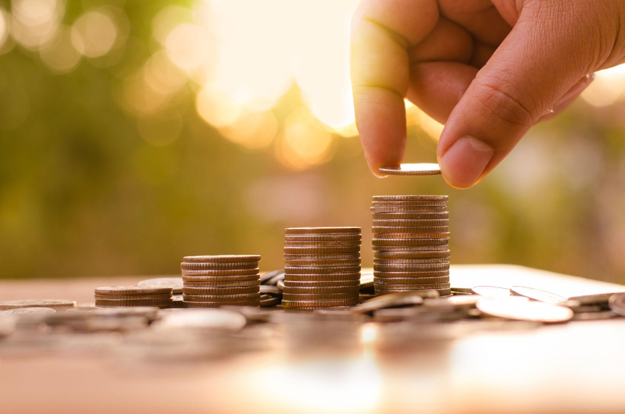 Coins and a piggy bank representing long-term savings and estate planning